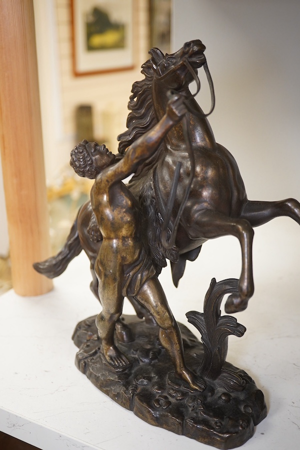 After Guillaume Coustou, a pair of dark patinated bronzes, The Marly Horses, 19th century, 25.5cm high. Condition - good.